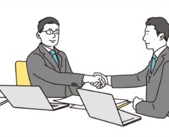 握手をする営業マン